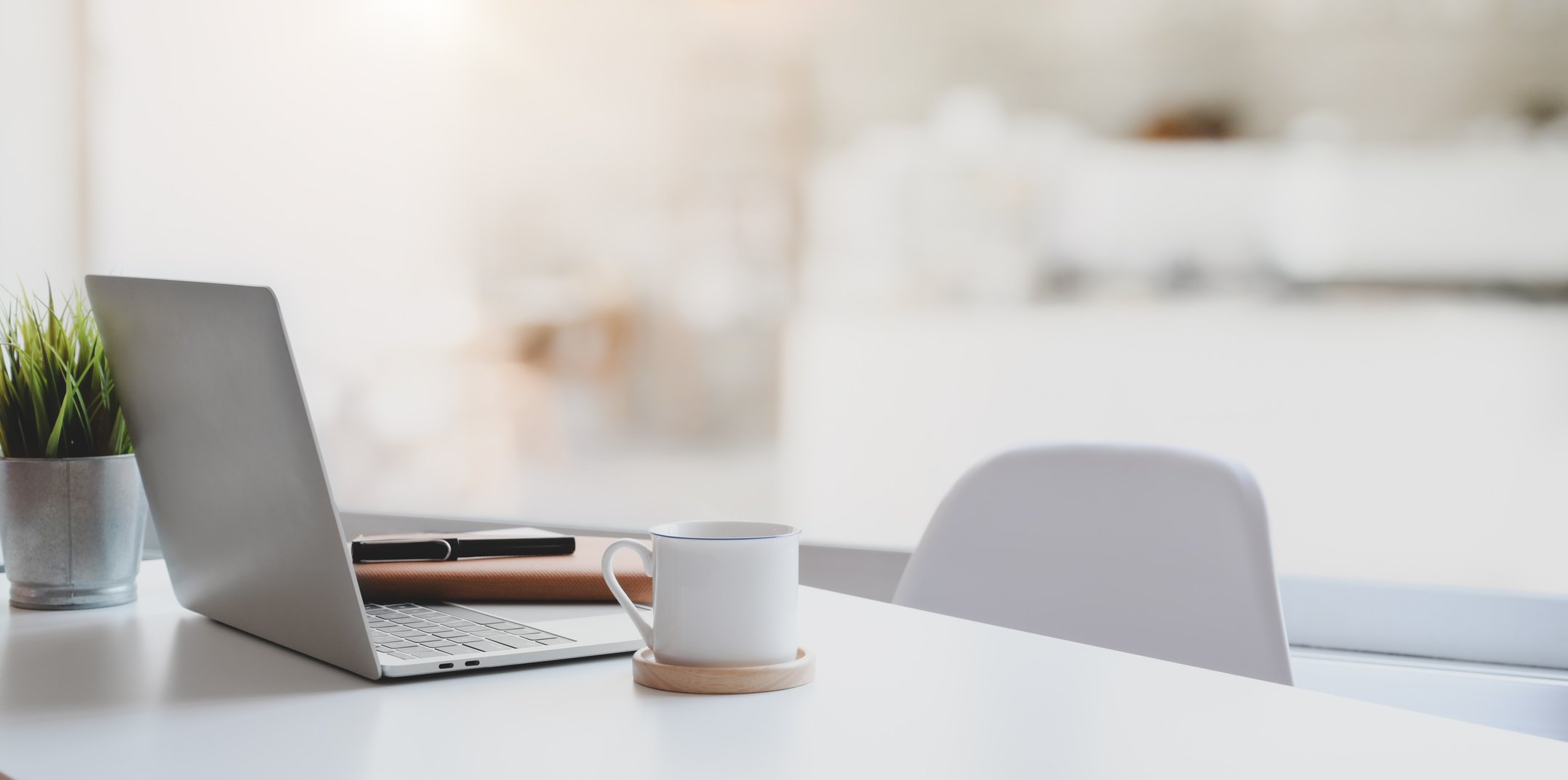 White Ceramic Mug on White Ceramic Saucer Beside Black Pen on White Table